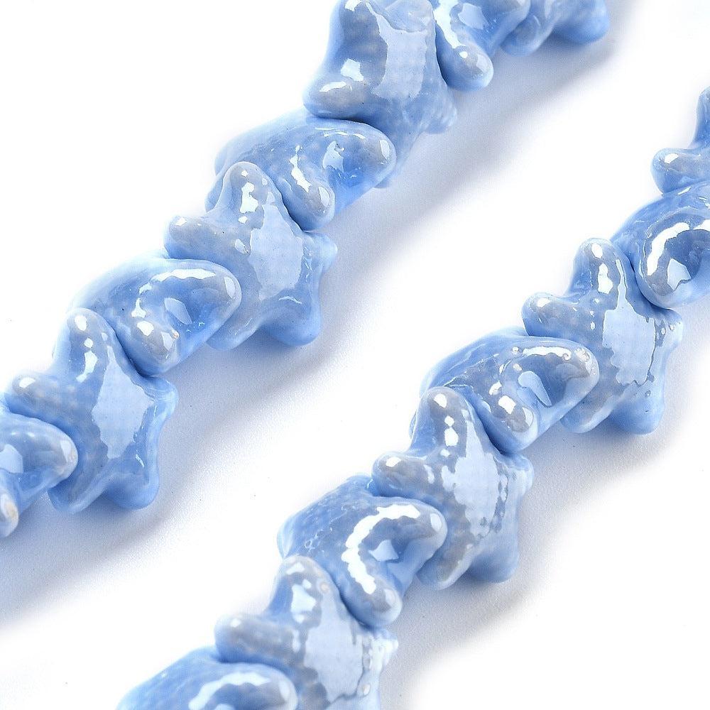 Kraal zeester cornflower blue porselein 12mm- per stuk